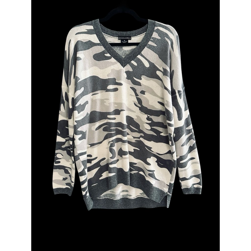 Folded cashmere sweater photographed by a marketplace seller